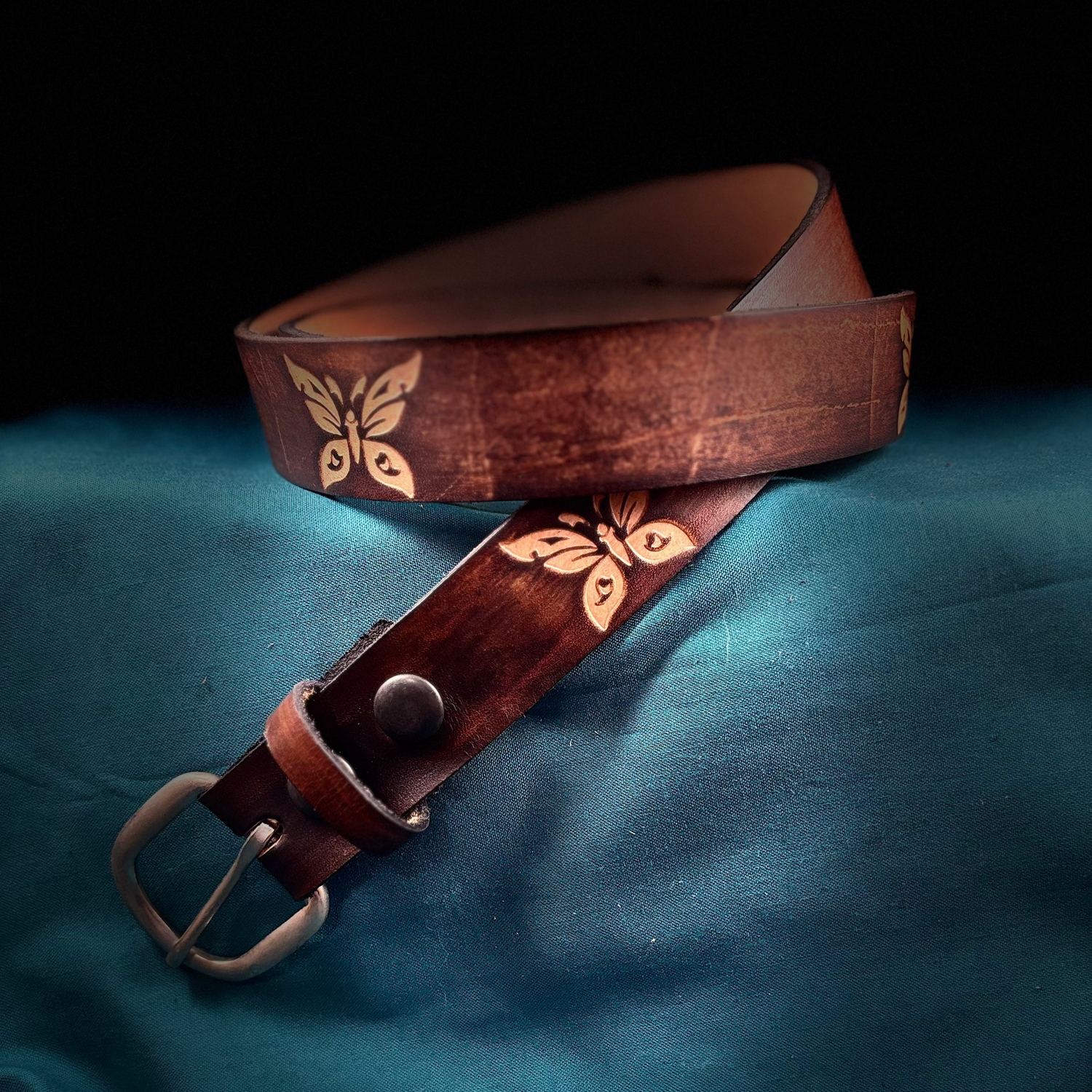 Brown butterfly belt on blue background