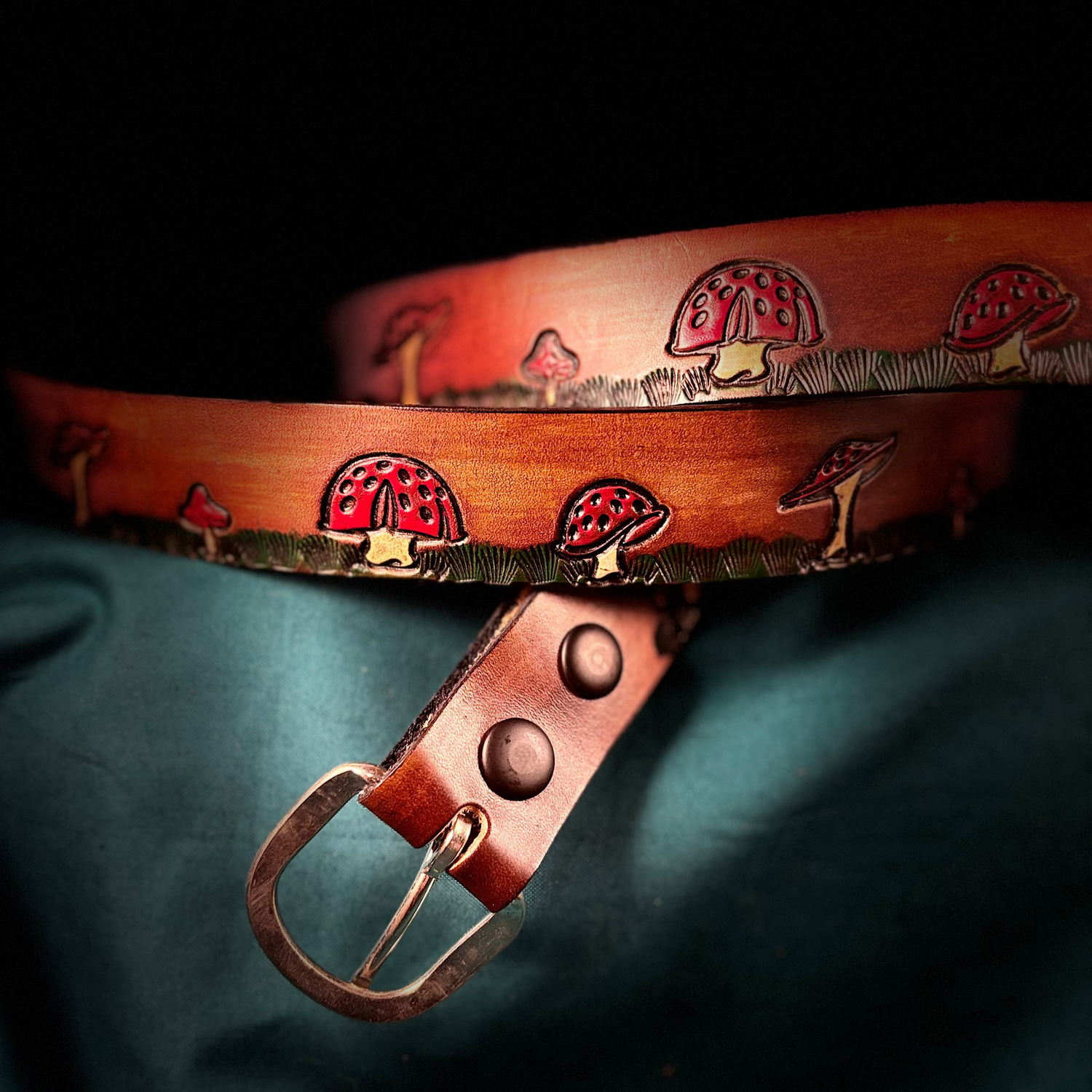 Mushroom printed leather belt on blue 