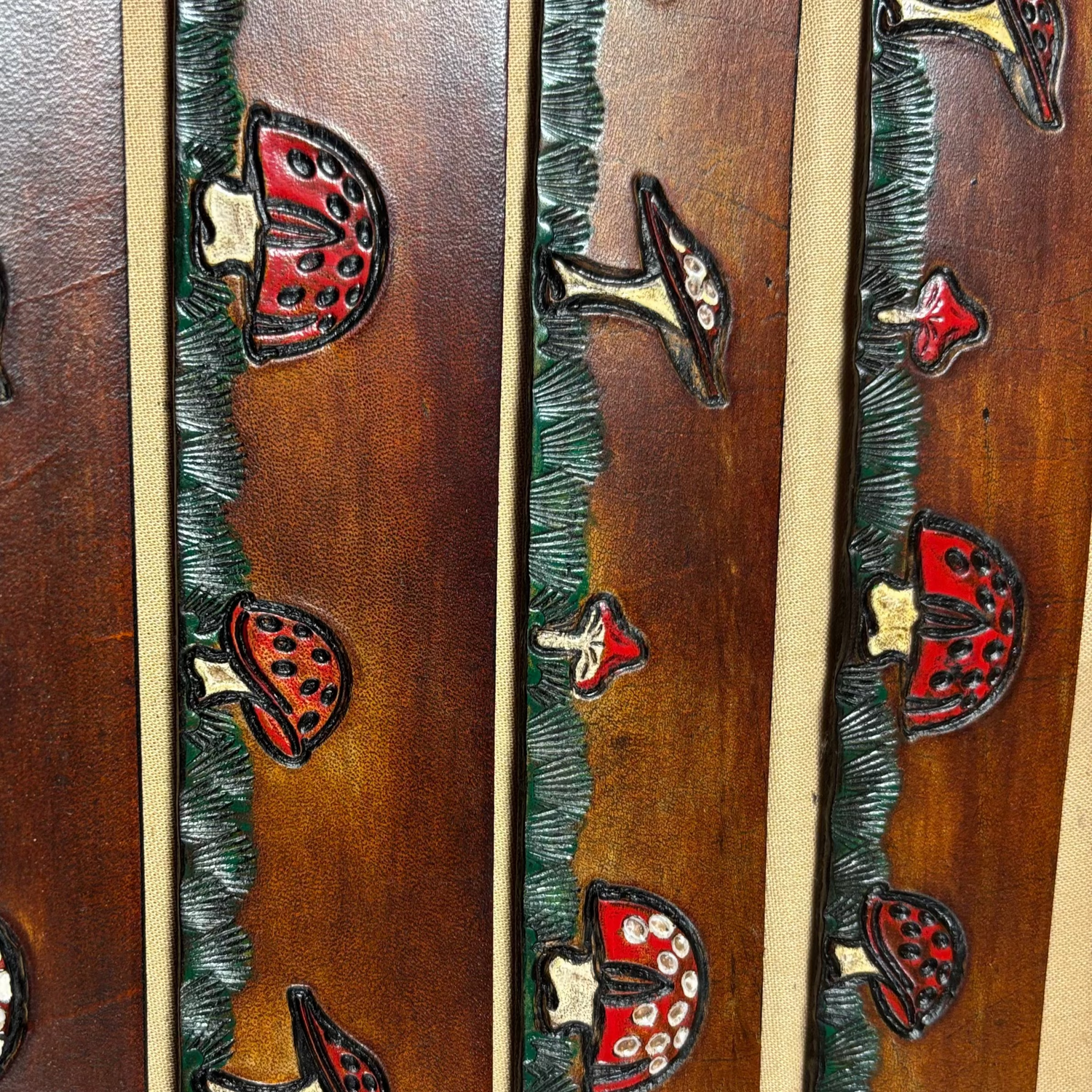 Decorative wooden panel with mushroom designs on a beige background